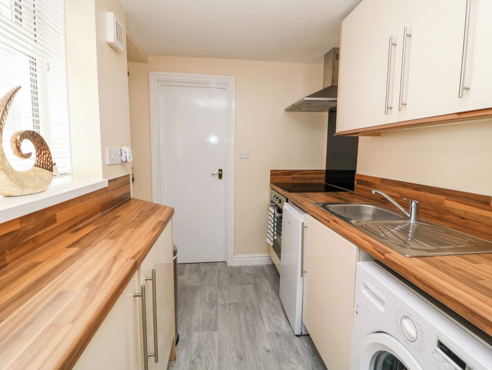 Fridge, toaster, cookware/dishes/utensils