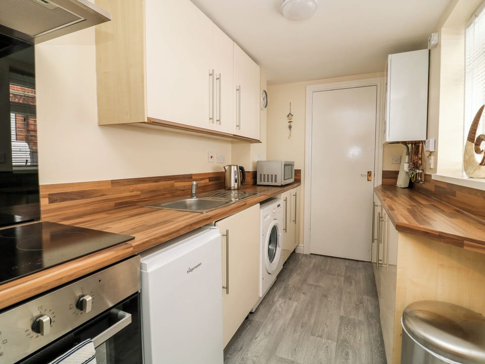 Fridge, toaster, cookware/dishes/utensils