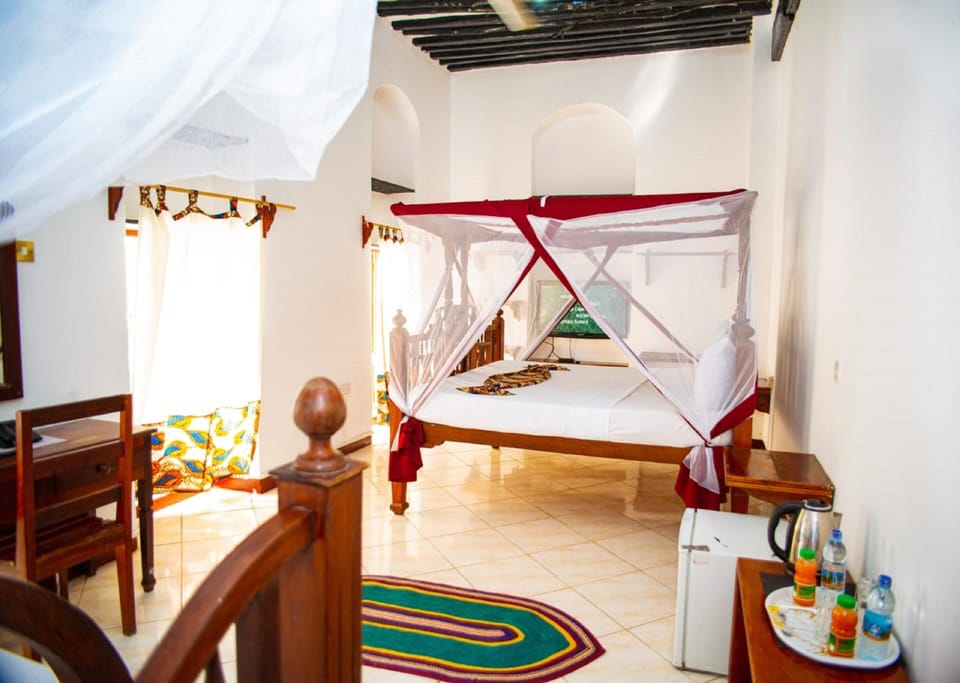 Premium bedding, down comforters, pillowtop beds, minibar
