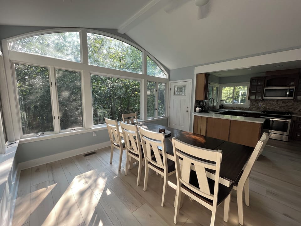 Sunny dining room open to the kitchen