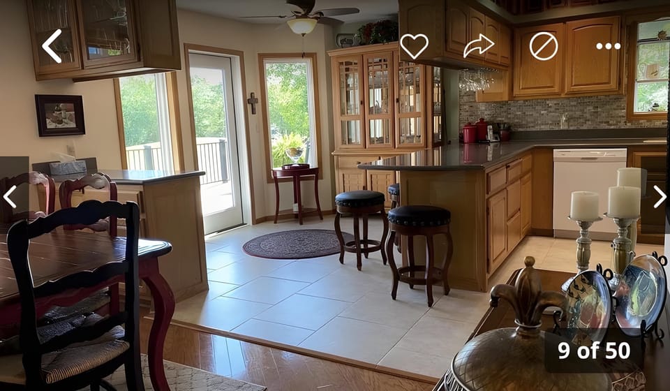 Upstairs dining area adjacent to the kitchen and living area and sunroom.