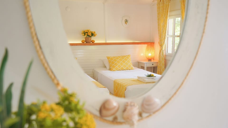 Basic Bungalow | Free minibar items, in-room safe, desk, laptop workspace