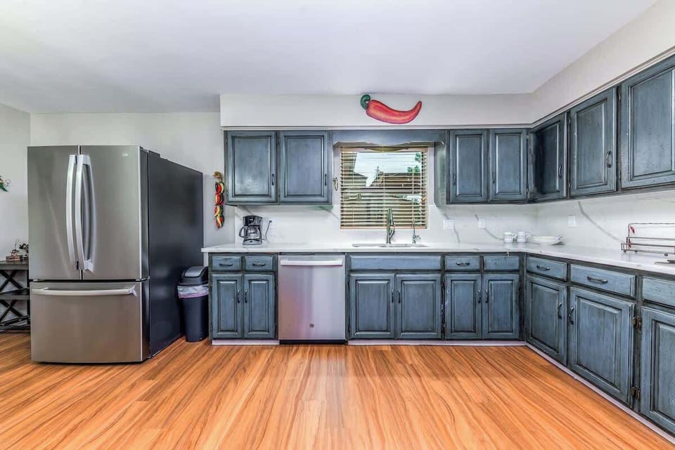 Fully equipped kitchen with stainless appliances — perfect for home-cooked meals.