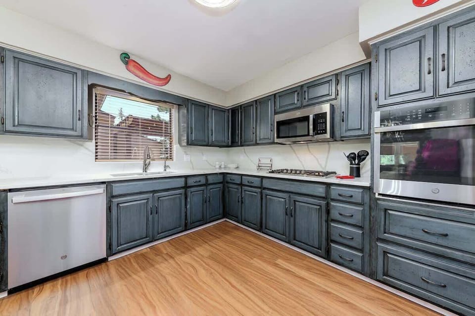 Whip up your favorite dishes in the fully stocked kitchen with stainless appliances.