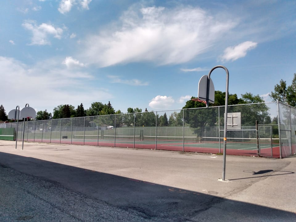 Tennis court and basketball hoops