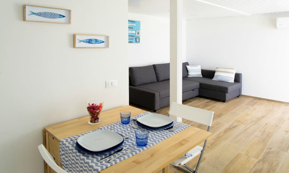 Family Bungalow, 2 Bedrooms, Sea View (3 Adults + 2 Children) | Living room | Flat-screen TV