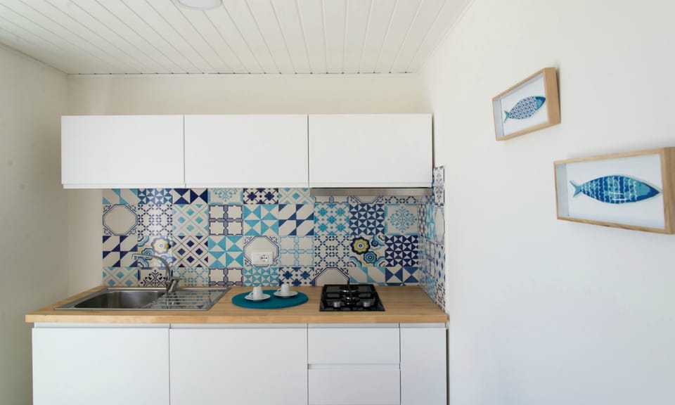 Family Bungalow, 2 Bedrooms, Sea View (3 Adults + 2 Children) | Private kitchenette | Full-size fridge, stovetop, cookware/dishes/utensils