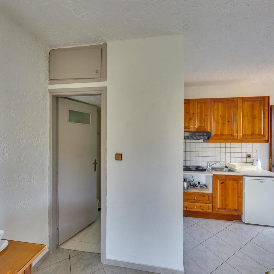 Fridge, electric kettle, cookware/dishes/utensils
