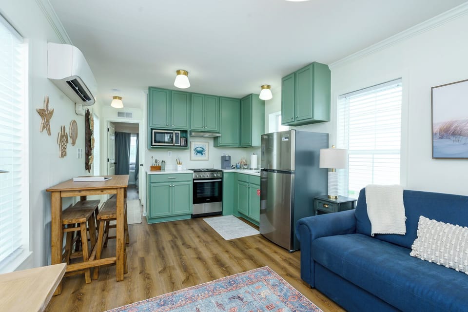 Full kitchen with many cooking essentials.