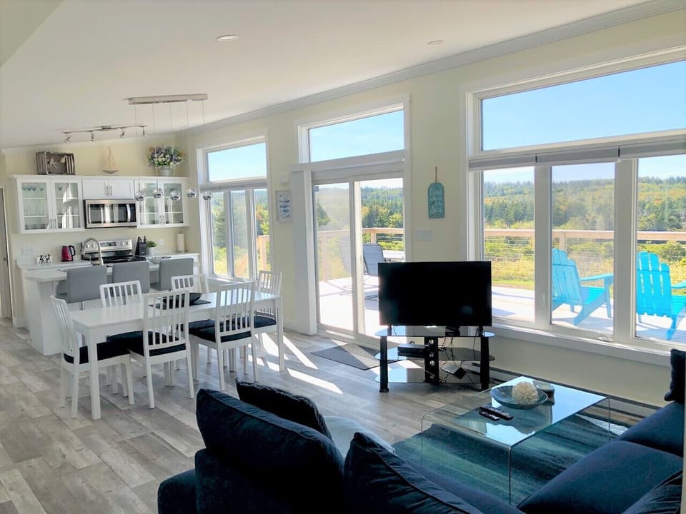 The open-concept living area  is great for entertaining and is flooded with natural light