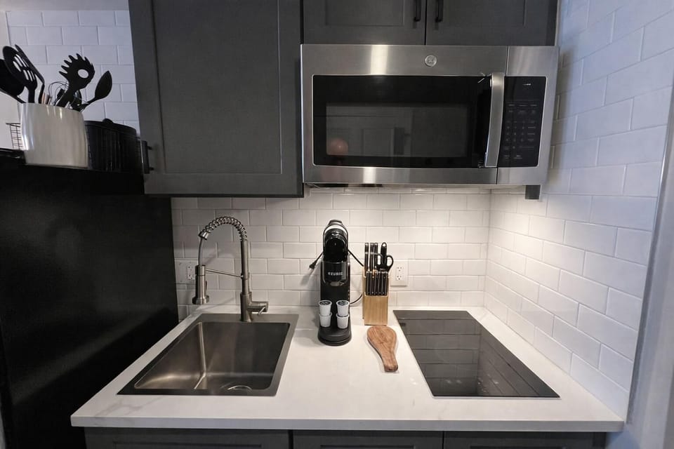 Sleek modern kitchen with stainless steel appliances and ample counter space