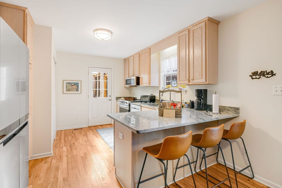 New stainless appliances, granite counters, all the cooking tools, and 9 seats!