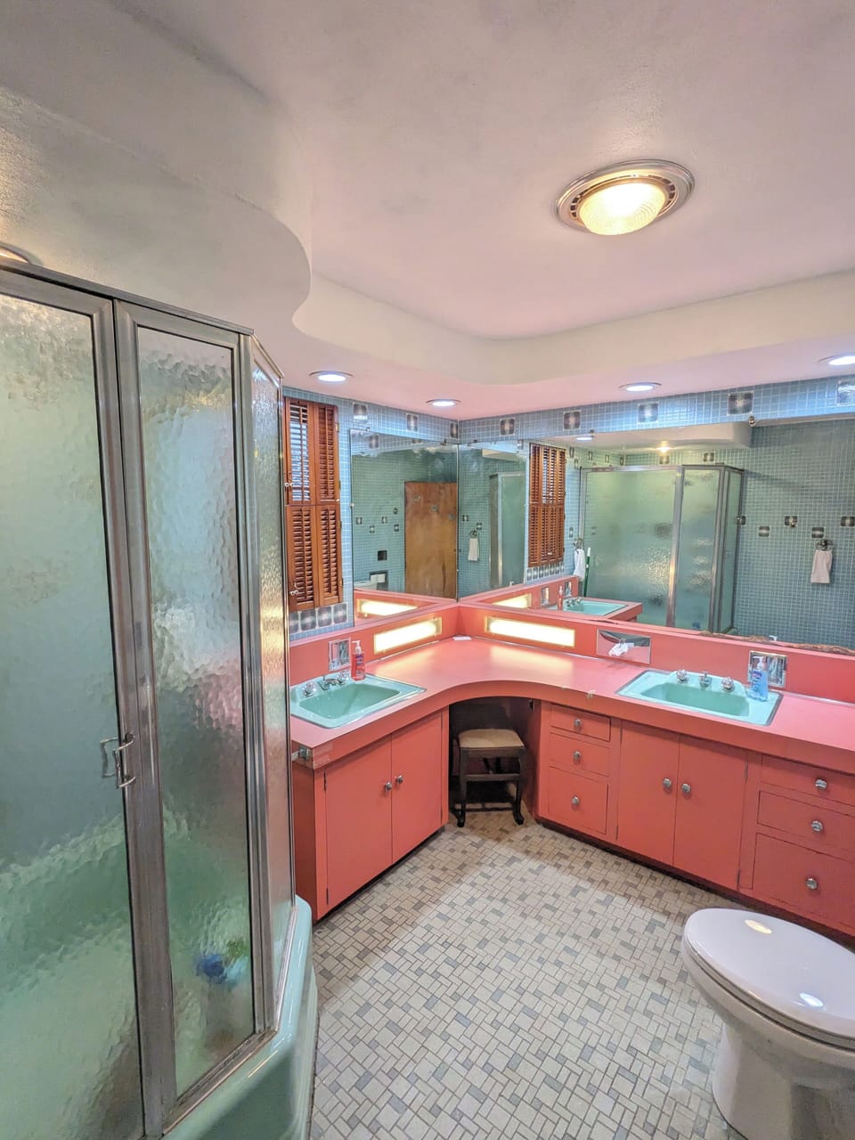 Upstairs bathroom with makeup lights built into the counter