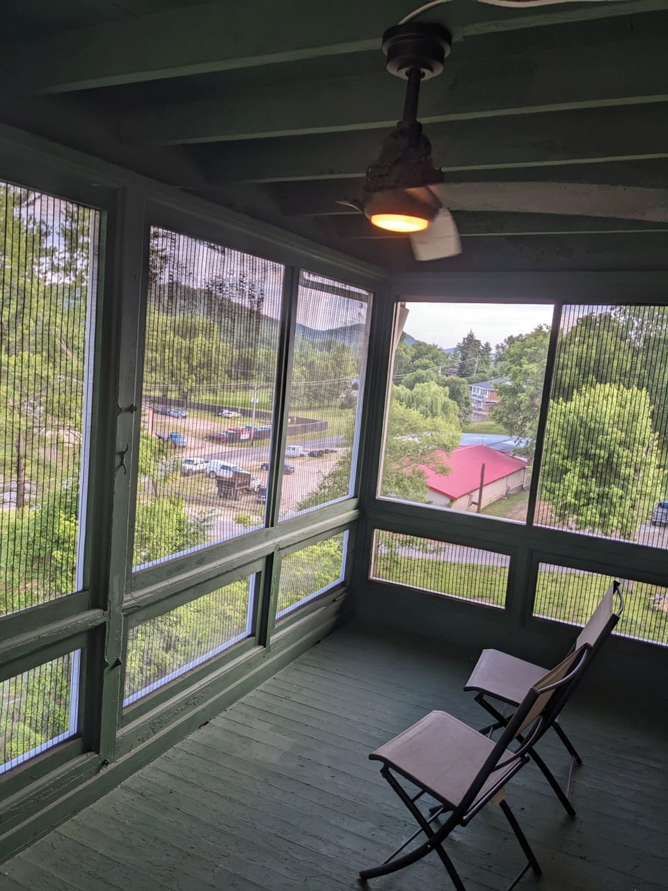 Upstairs sleeping porch with remote controlled ceiling fan and light.  