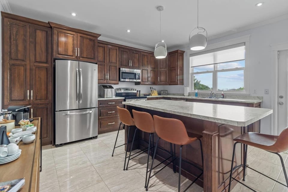 Culinary Masterpiece: A Fully Equipped Kitchen with a Center Island, Where Creativity Meets Convenience