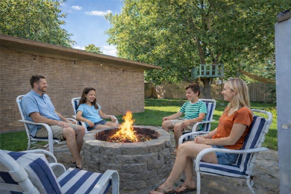 You may just love the back yard more than the house.  You have full use of the playhouse, tree fort and fire pit.  Or you can just lounge on the large covered patio and sip your tea or coffee and watch the squirrels play.