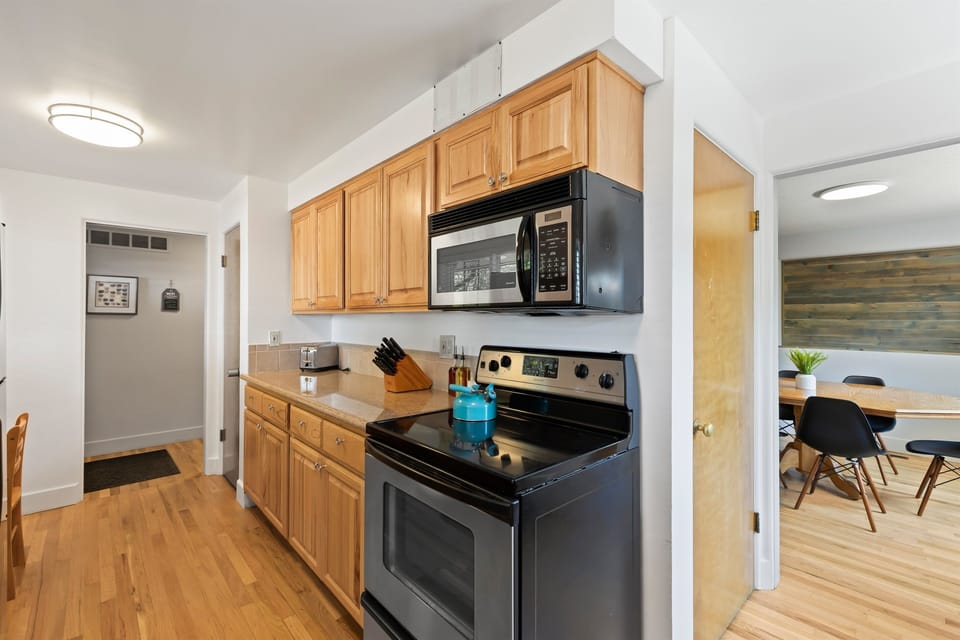 View of the oven/range and microwave.