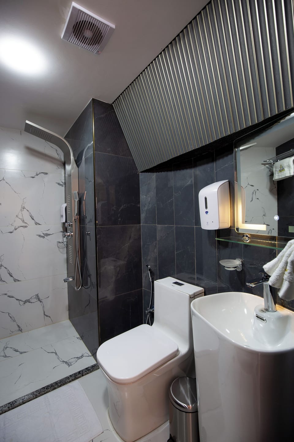 Rainfall showerhead, towels, soap, shampoo