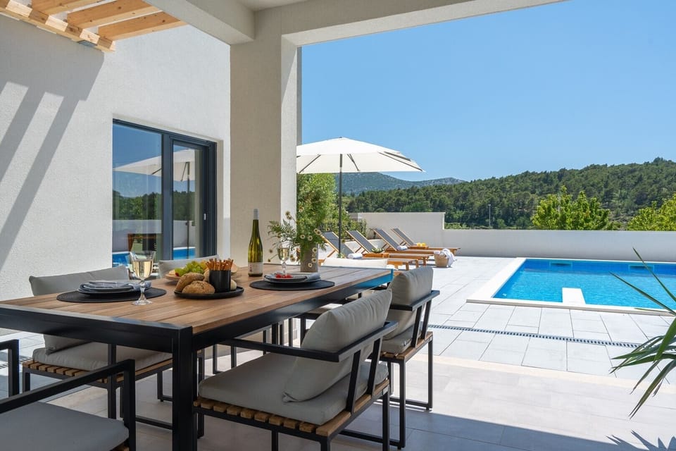 a covered dining area for 8 people
