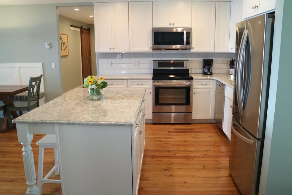Kitchen in the main cottage includes dishwasher, microwave, fridge & oven. 