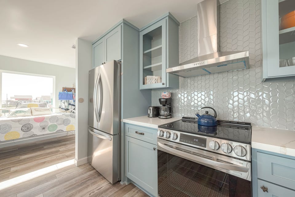 Oven with built in air fryer. Huge fridge. All new stainless appliances