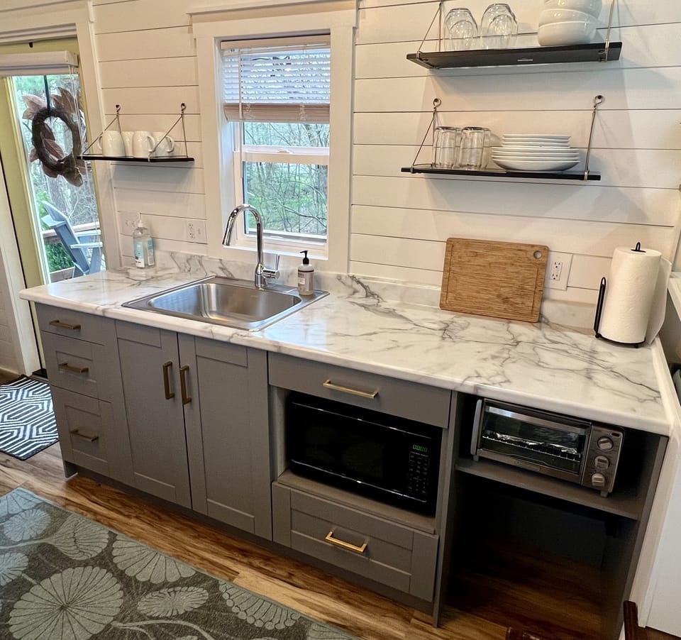 The kitchen has plenty of space and all you need to create and eat a terrific meal.