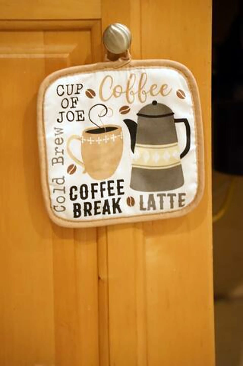 Cozy coffee-themed kitchen detail with warm, welcoming charm
