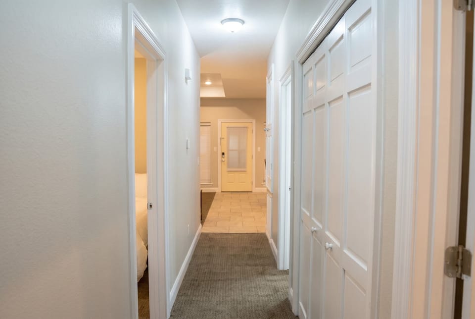 Bright hallway with ample storage and a clean, welcoming flow