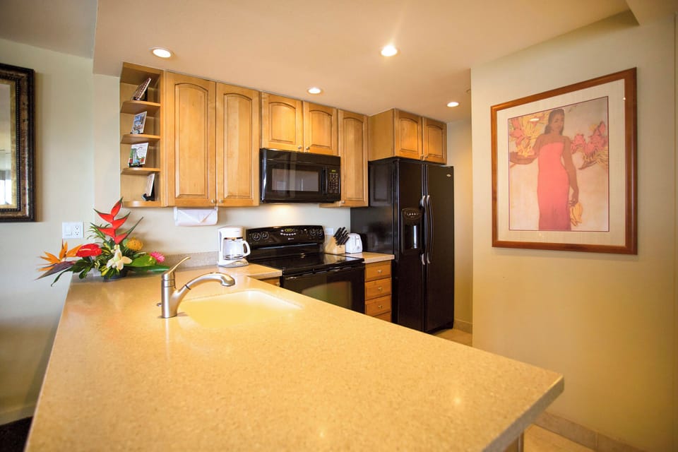 Your fully equipped kitchen features modern appliances, ample counter space, and warm wood cabinetry—perfect for preparing meals and gathering with loved ones.
