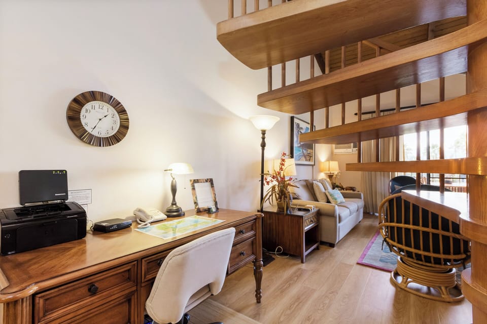Step into your sunlit workspace with elegant wooden furnishings and soaring ceilings, perfect for staying productive while you're away from home.