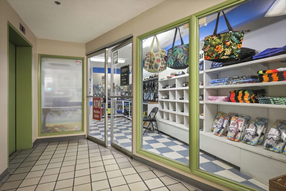 Browse colorful totes, beach towels, and souvenirs at the on-site shop—perfect for grabbing vacation essentials without leaving the property.