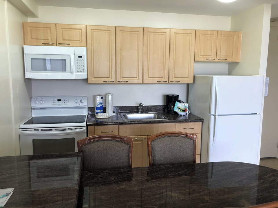 Your fully equipped kitchen has everything you need to cook up a delicious meal, with a spacious dining table ready for gathering and enjoying great food together.