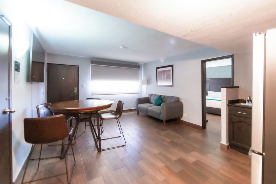 Junior Studio Suite, Kitchen | Premium bedding, desk, laptop workspace, iron/ironing board
