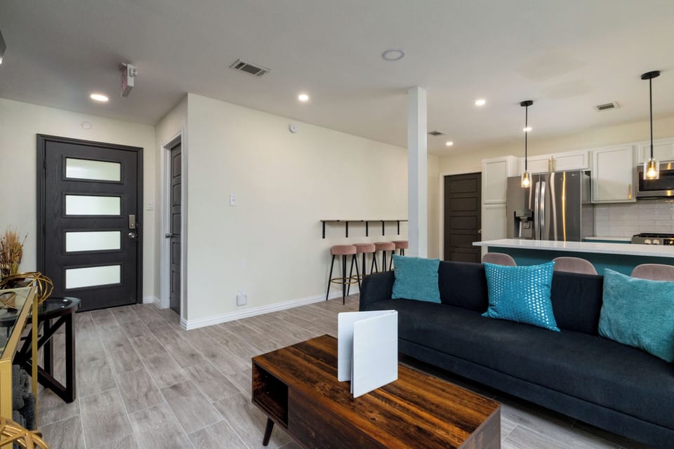 Modern entryway with glass door and space-saving breakfast bar