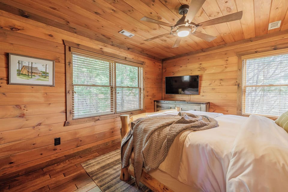 Sun-filled upstairs bedroom at Above the Clouds — wake up surrounded by mountain cabin charm at this Blue Ridge, GA vacation rental in North Georgia.
