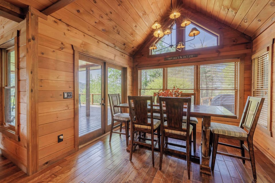 Rustic dining table for the whole family — Above the Clouds cabin near Blue Ridge, GA, offers a warm, shared space for mountain vacation memories.
