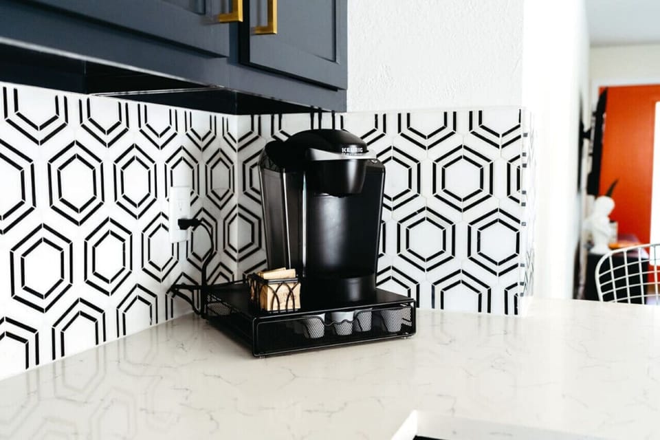 Coffee station w/ bold patterned tile adds a fun pop for morning routines.
