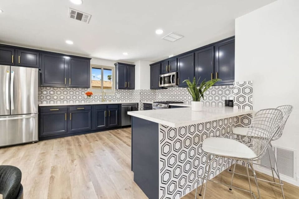 Chef-ready kitchen island w/ bar seating makes cooking & conversation effortless.