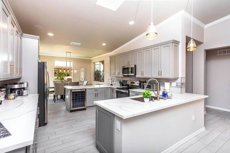 Yes a wine refrigerator! Beautiful white marble counter tops. New house means new appliances.