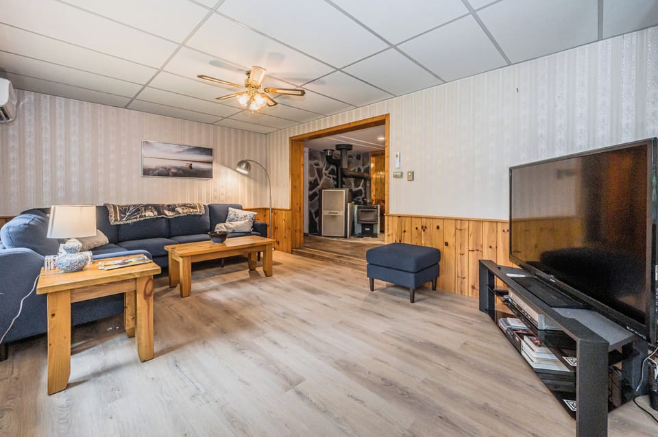Ceiling fan, comfy couches, and a large TV, to keep you cool, relaxed and entertained.
