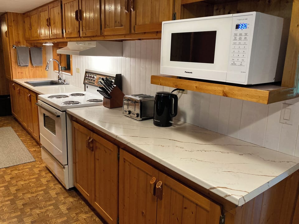 A well stocked kitchen and luxurious counters make preparing meals simple and easy. Boasting locally sourced wood cabinetry and all the essentials for a home-cooked meal, unleash your inner chef!