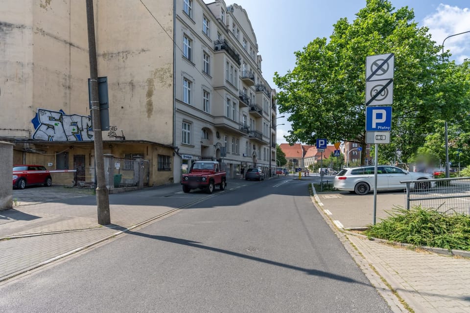 Street view showing the historic neighborhood's charming architecture and well-maintained surroundings.

