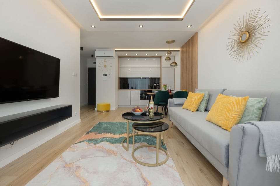 Open living and dining area with contemporary furnishings and a minimalist design.

