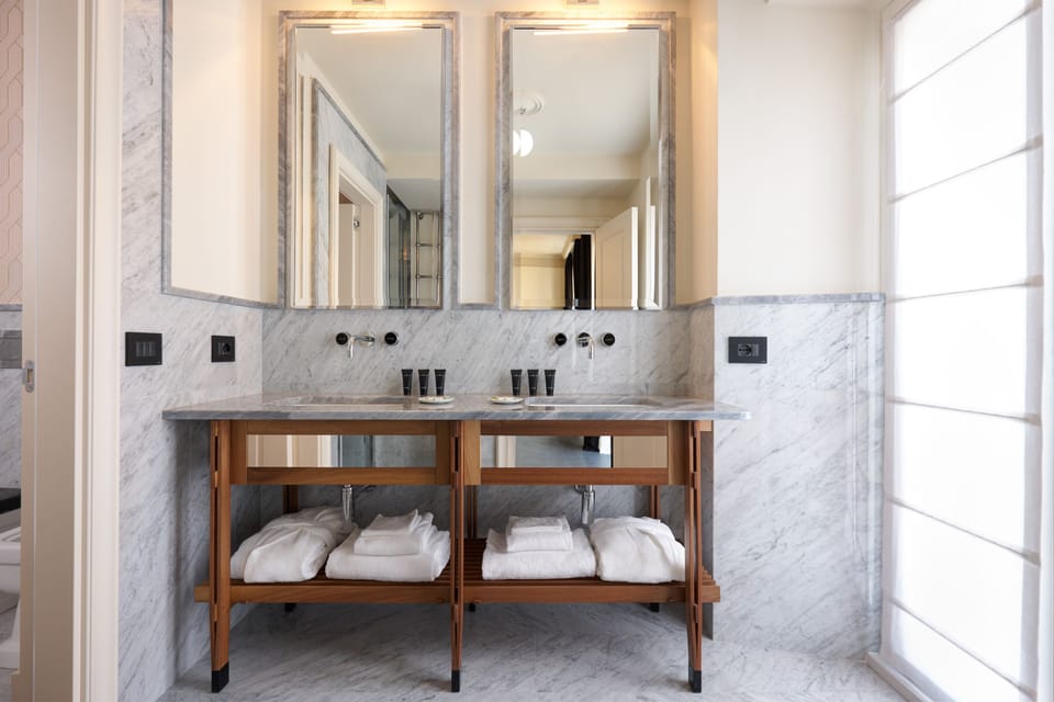 Shower, rainfall showerhead, designer toiletries, hair dryer