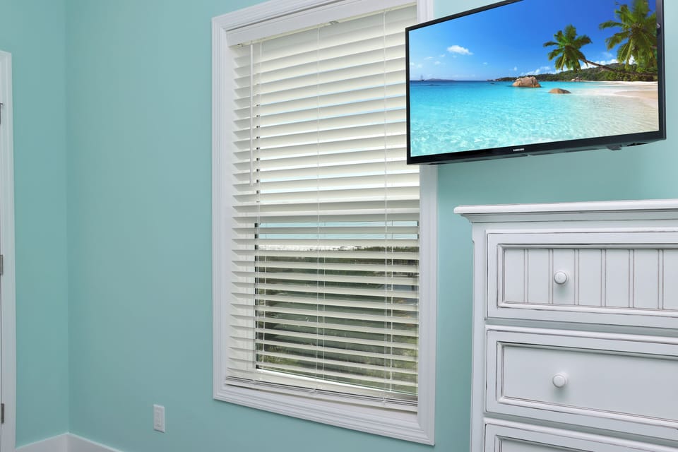Bedroom 1 with TV and Beach View