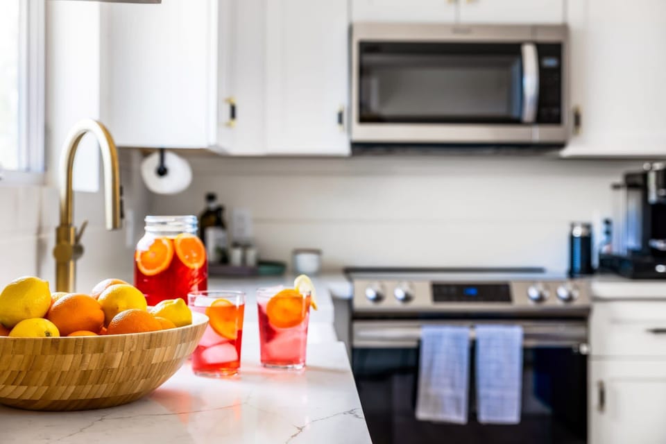 Fully equipped kitchen with high-end appliances for preparing meals at home
