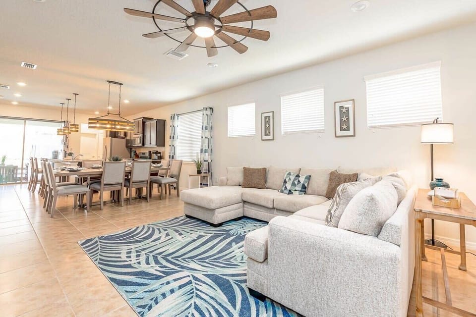 The main-level sitting area features a comfy sofa and a Smart TV with cable.
