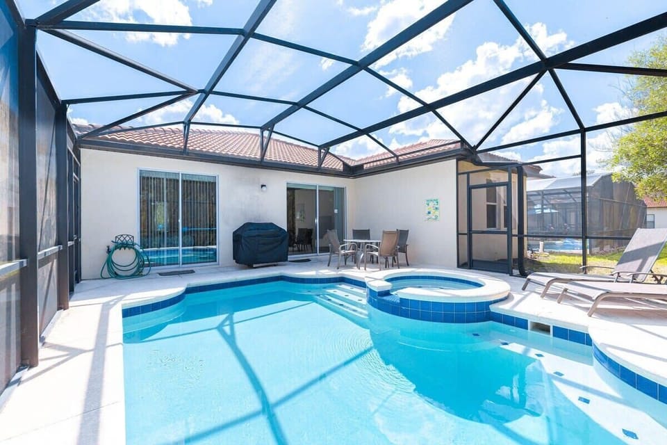 Relax by your private pool, complete with outdoor furniture.