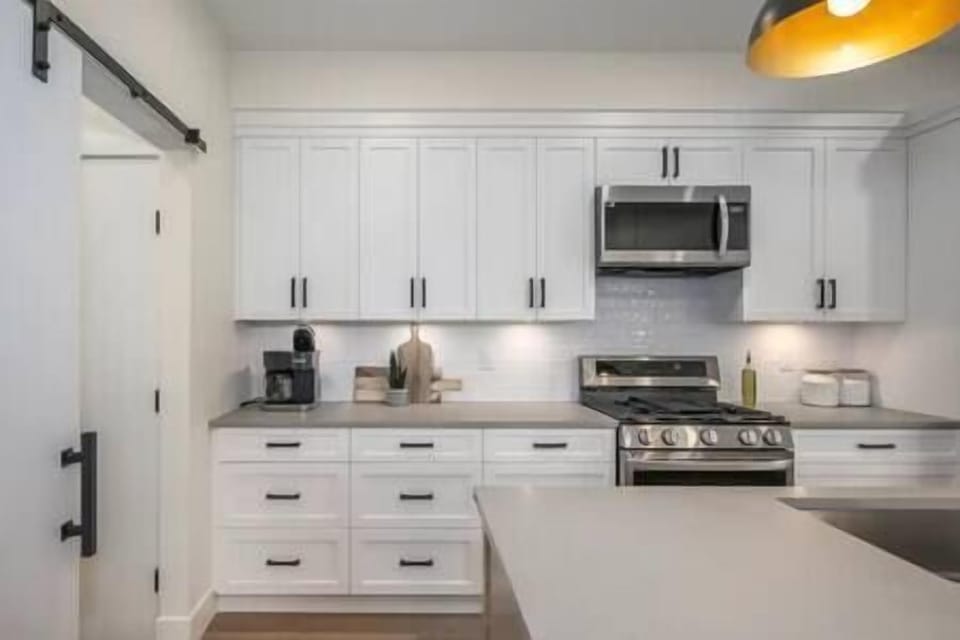 Another angle of the kitchen with stainless steel appliances
