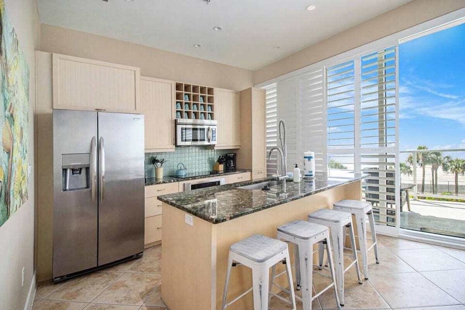 Kitchen with full-size frig, oven, dishwasher and microwave
